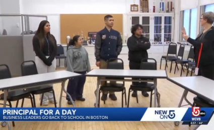  Students standing in a classroom space with Assistant Head of School Jennifer Greenfield